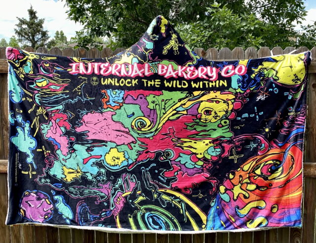 Wrap Yourself in Wild Comfort Perfect for cool Colorado evenings, festival nights, or stargazing in the backyard. These hooded blankets feature my original hand-drawn artwork printed in vibrant detail on luxuriously soft crystal velvet, with plush Berber fleece inside for warmth. Lightweight, cozy, and expressive, each cloak blanket is designed to move with you—whether you’re dancing in a field, camping under the stars, or simply unlocking the wild within from your couch. ✨ One size fits most (60" x 80") 🌀 Hand loop in the top corner for easy wrap-around comfort 🌿 Soft, lightweight, and warm 🎶 Perfect for festivals, camping, concerts, or home 🎨 Features 3 exclusive Internal Bakery designs