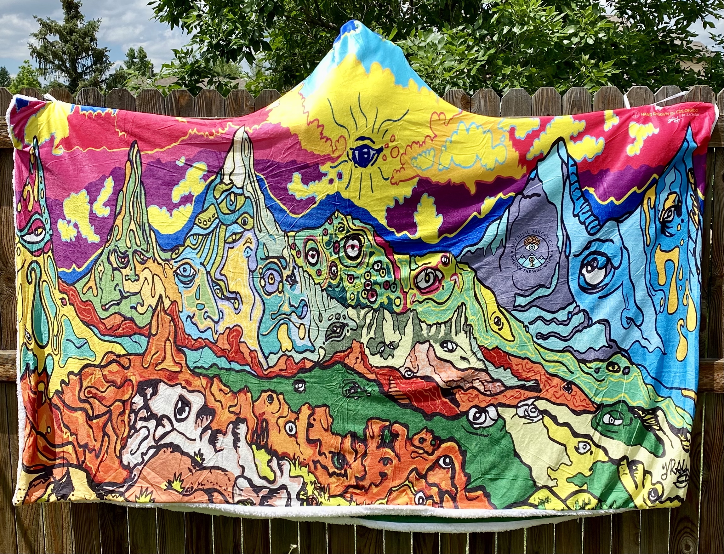 Wrap Yourself in Wild Comfort Perfect for cool Colorado evenings, festival nights, or stargazing in the backyard. These hooded blankets feature my original hand-drawn artwork printed in vibrant detail on luxuriously soft crystal velvet, with plush Berber fleece inside for warmth. Lightweight, cozy, and expressive, each cloak blanket is designed to move with you—whether you’re dancing in a field, camping under the stars, or simply unlocking the wild within from your couch. ✨ One size fits most (60" x 80") 🌀 Hand loop in the top corner for easy wrap-around comfort 🌿 Soft, lightweight, and warm 🎶 Perfect for festivals, camping, concerts, or home 🎨 Features 3 exclusive Internal Bakery designs