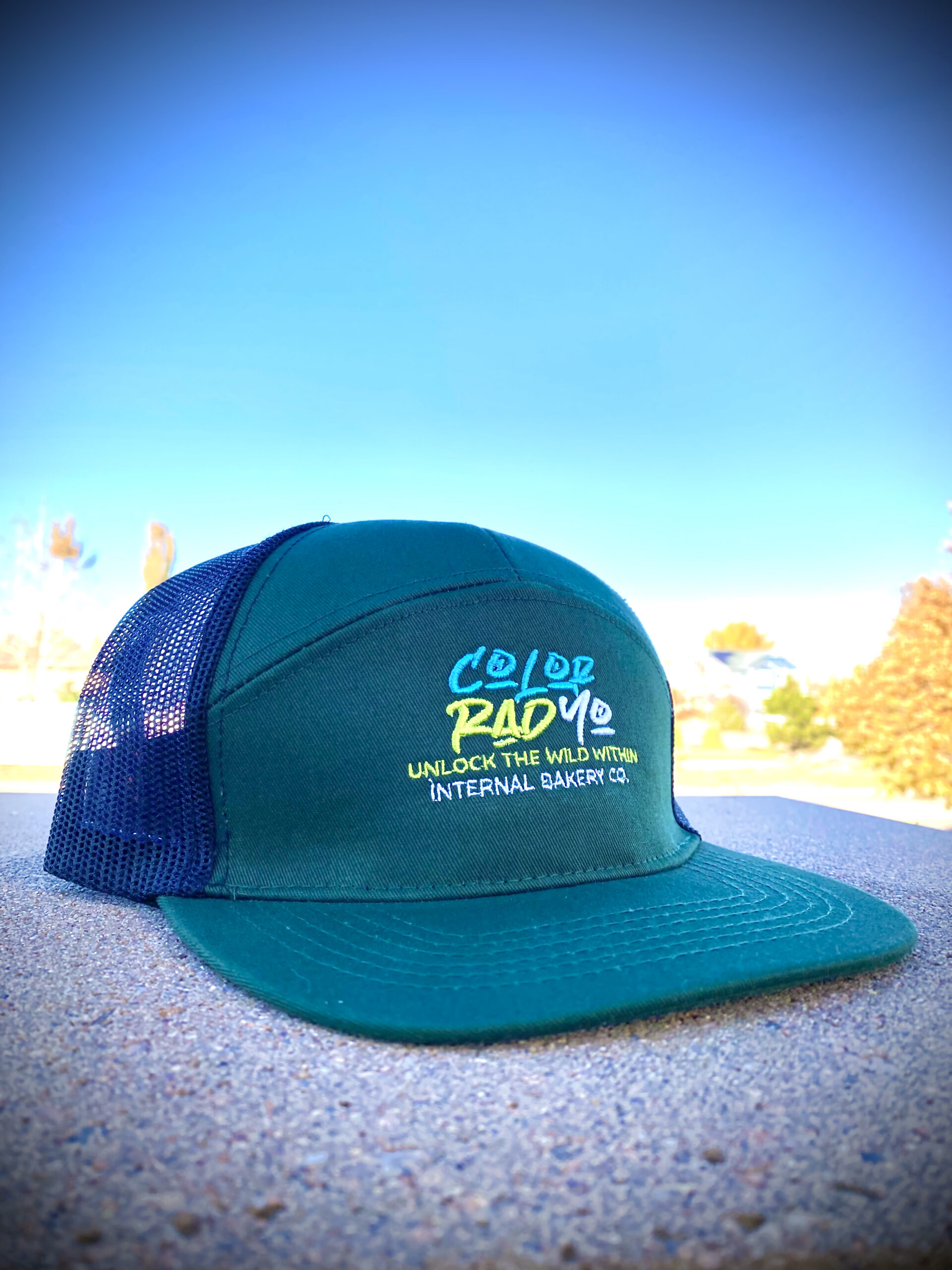 Color Rad Yo — Internal Bakery Snapback Hat 🧢🌄 Say it fast, say it twice — you might never call it Colorado again. Introducing Color Rad Yo, a bold twist on our home state brought to life by Internal Bakery. This 7-panel snapback features an Emerald green base embroidered with Lime, Sky Blue, and White threads for that vibrant pop you can spot from a mile away. Look closely and—like all Internal Bakery designs—you might just find a hidden face tucked within the letters. Born from imagination and stitched with style, this hat isn’t just a nod to Colorado—it’s a whole new vibe. Details: 🪡 Internal Bakery original design & embroidery 🟢 7-panel Emerald base 🌈 Lime, Sky Blue & White thread detailing 🎨 Hidden artistic touch within the font Add it to your collection and rep your state the Color Rad Yo way.