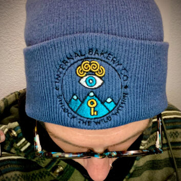 Meet the beanie that marks a new era for Internal Bakery. Featuring our brand-new rebranded logo, this piece embodies the heart of our mission — to Unlock the Wild Within and connect deeper with imagination, creativity, and the world around us. Crafted on a soft light navy base, the embroidery pops with bold color and intention, making this beanie more than just a hat — it’s a symbol of our journey and community. Whether you’re out exploring, creating, or simply staying cozy, it’s designed to move with you. Details: 🧵 Premium embroidery of the new Internal Bakery logo 🌊 Light Navy beanie — soft, warm, and built for everyday wear 🎨 Symbol of creativity, connection, and the wild within 🔥 Perfect for adventures, markets, or daily inspiration Wear the story. Feel the vision. Unlock the Wild Within.