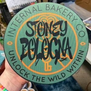 Get ready for a surprise straight from the imagination bakery. The Stoney Bologna Mystery Dab Mat is a 7.5" round, 5mm thick silicone mat featuring hand-drawn artwork where even the letters are a little stoned themselves — filled with fun faces, hidden expressions, and good vibes baked right into the design. The twist? You won’t know exactly which color palette you’re getting until it lands in your hands. Every mat is unique, so your mystery pick could be anything from electric neons to mellow earth tones, all tied together by the signature Stoney Bologna artwork. Perfect for your sesh setup, art table, or collector shelf — no two are the same, and that’s the fun of it. Details: 🌀 7.5" round x 5mm thick premium dab mat 🎨 Hand-drawn design with stoney letters & hidden faces 🔥 One-of-one color variations — shipped at random 💨 Heat-resistant, easy to clean, and made to vibe Add one to your cart and let the mystery unfold — each mat’s got its own buzz.