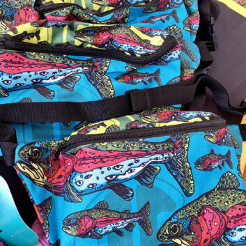 Lookout Trout Fanny Pack — Hand-Drawn by Internal Bakery 🎨🐟 Meet the Lookout Trout Fanny Pack — a colorful, hand-drawn design brought to life by Internal Bakery. Inspired by the rainbow trout and reimagined through an imaginative lens, each speckle has been transformed into watchful eyes, turning this fish into a living piece of art that’s guaranteed to catch attention wherever you go. This pack features a multi-colored panel layout and two roomy zip pockets — one large in the front and a hidden pocket on the back — giving you space for all your essentials while keeping your hands free. Whether you’re fishing, hiking, traveling, working, or just on the move, this pack blends bold creativity with everyday functionality. Customers can’t stop raving about the quality, comfort, and conversation-starting design — it’s the perfect balance of utility and imagination. Perfect for: 🌈 Everyday use & travel 🎣 Fishing & outdoor adventures 🎨 Festivals & creative outings 🧤 On-the-job or hands-free days Empty your pockets, strap in, and let your imagination go wild.