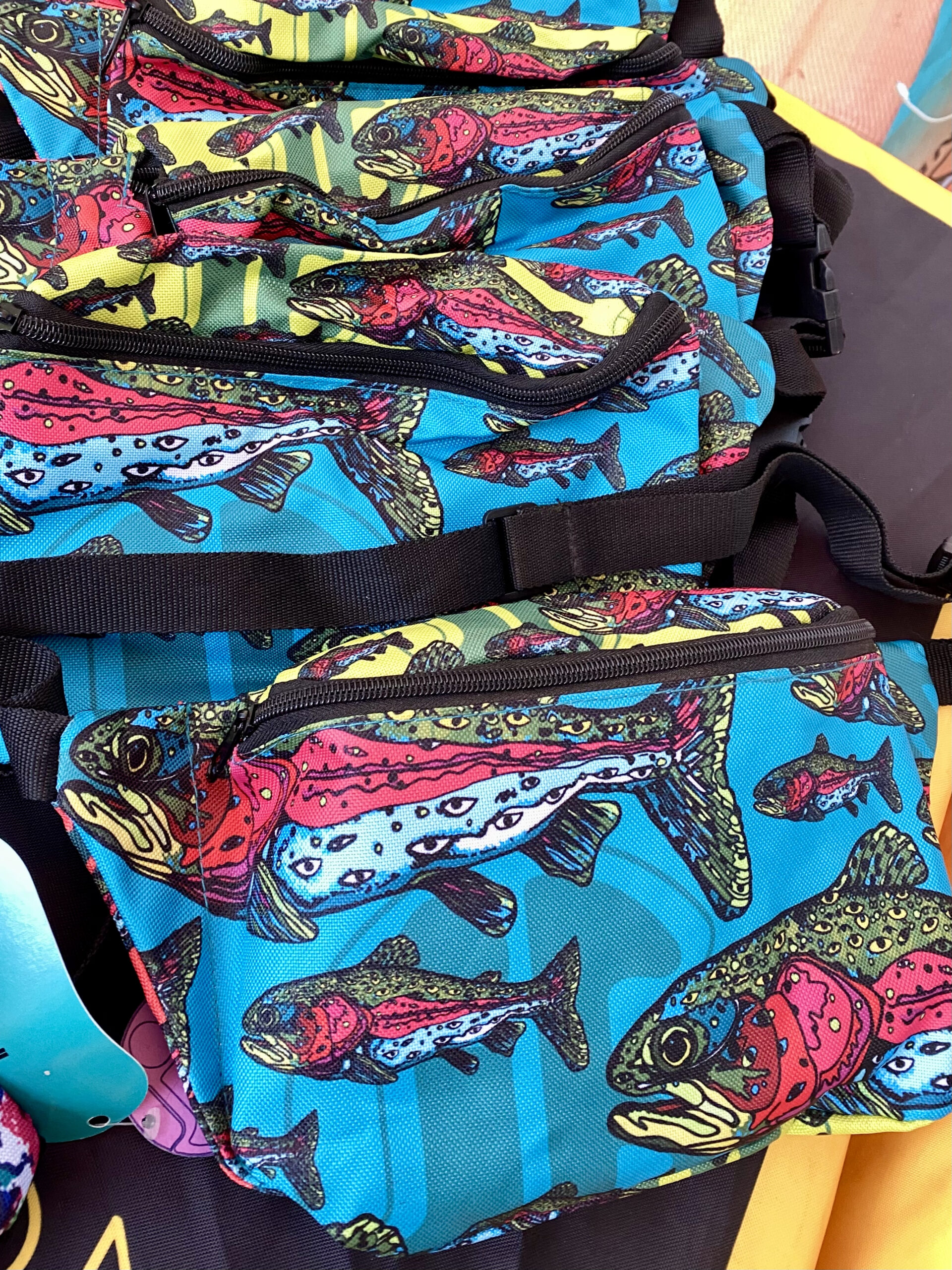 Lookout Trout Fanny Pack — Hand-Drawn by Internal Bakery 🎨🐟 Meet the Lookout Trout Fanny Pack — a colorful, hand-drawn design brought to life by Internal Bakery. Inspired by the rainbow trout and reimagined through an imaginative lens, each speckle has been transformed into watchful eyes, turning this fish into a living piece of art that’s guaranteed to catch attention wherever you go. This pack features a multi-colored panel layout and two roomy zip pockets — one large in the front and a hidden pocket on the back — giving you space for all your essentials while keeping your hands free. Whether you’re fishing, hiking, traveling, working, or just on the move, this pack blends bold creativity with everyday functionality. Customers can’t stop raving about the quality, comfort, and conversation-starting design — it’s the perfect balance of utility and imagination. Perfect for: 🌈 Everyday use & travel 🎣 Fishing & outdoor adventures 🎨 Festivals & creative outings 🧤 On-the-job or hands-free days Empty your pockets, strap in, and let your imagination go wild.