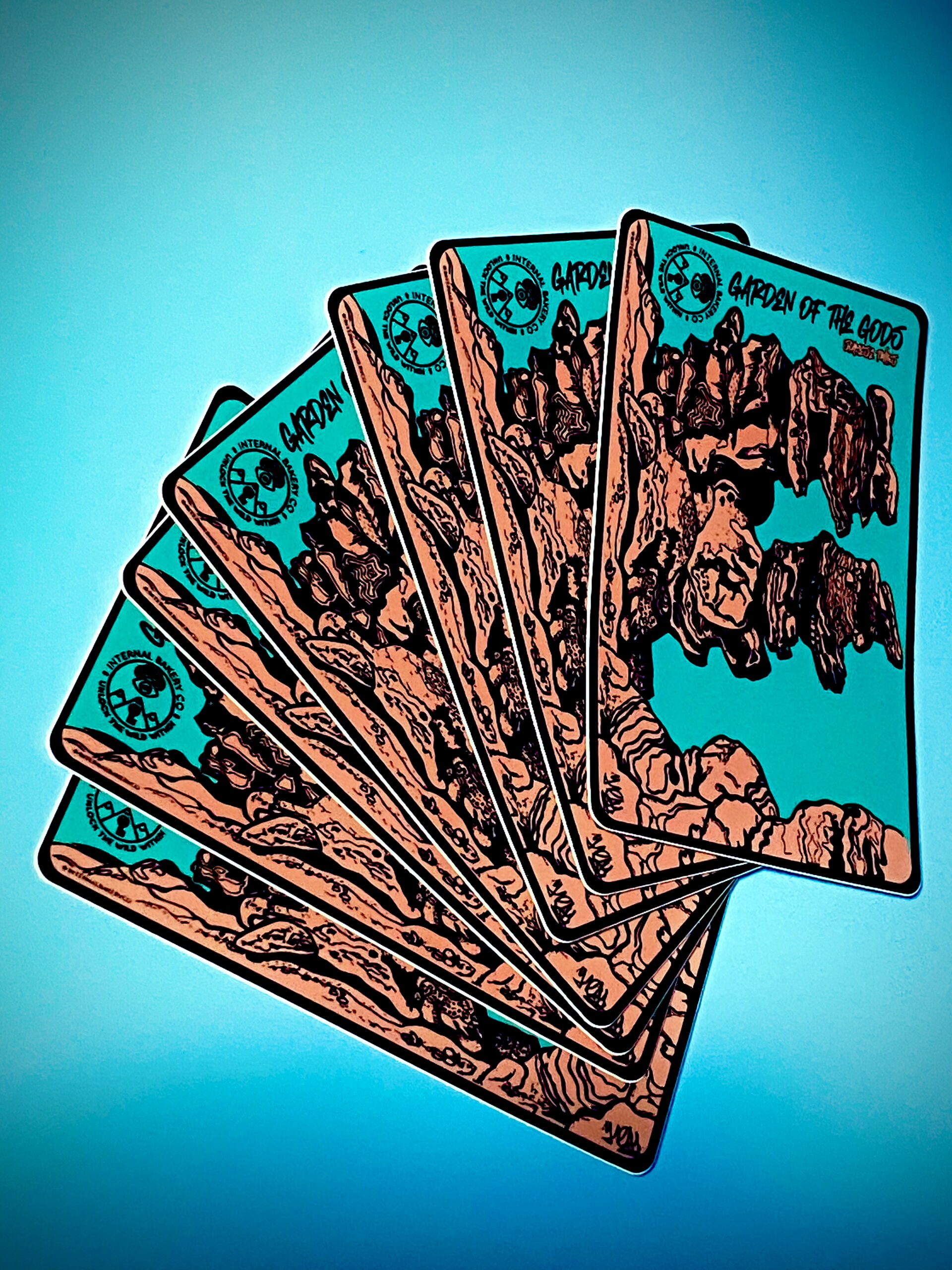 Siamese Twins” Sticker (5″ × 3″) This hand-drawn pen and ink piece captures the iconic Siamese Twins rock formation at Garden of the Gods — a view every local knows, but few have seen like this. Drawn in my signature style, the lines flow naturally, and if you look close enough, you might spot faces or shapes coming to life on their own. That’s the beauty of imagination — it’s not about what you put in, but what you discover once it’s there. Finished with the new Internal Bakery logo, this design pays homage to Colorado Springs and the creative flow that starts right here.