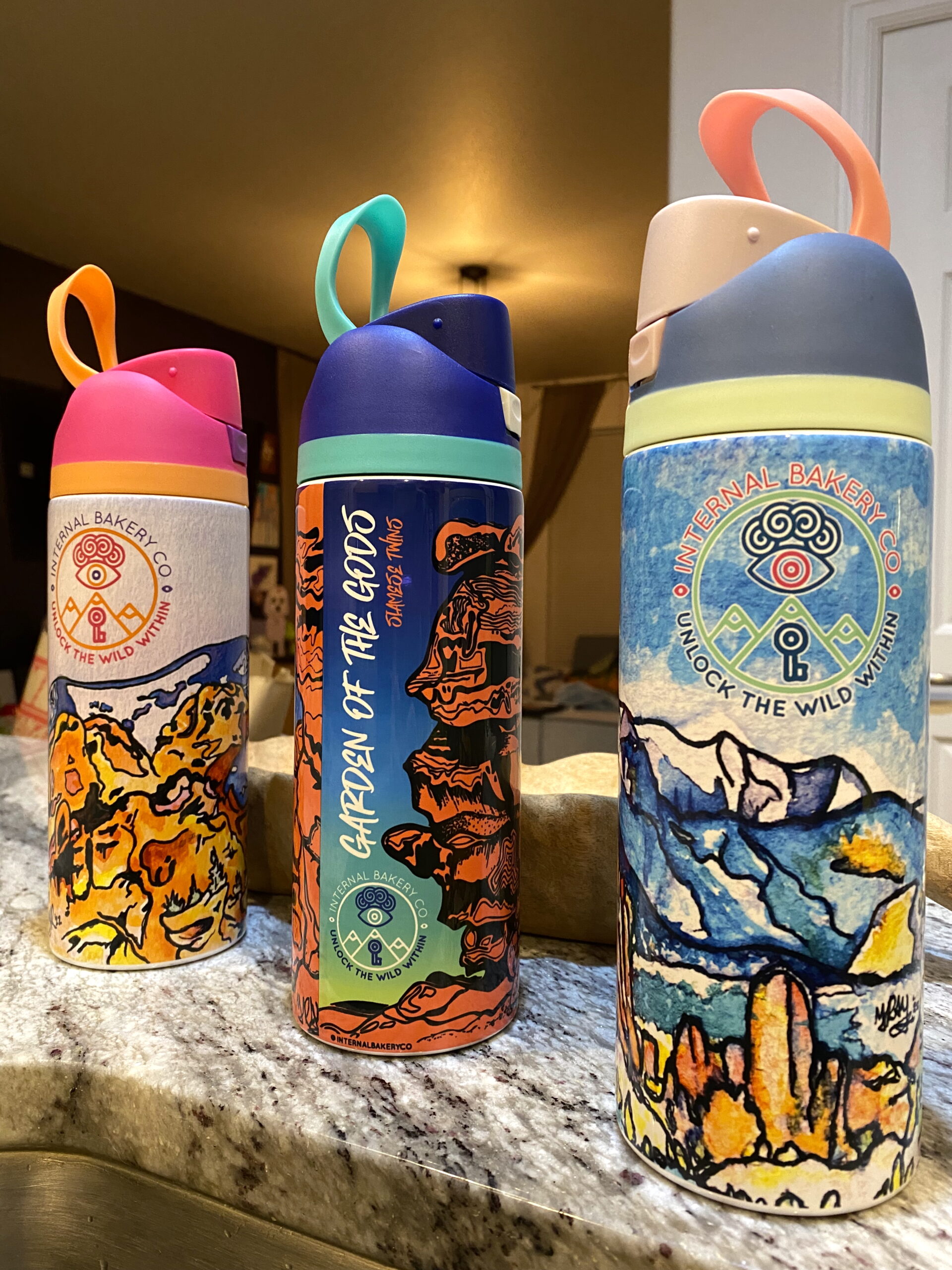 Garden of the Gods Artist Series â 3 Bottle Set A premium 20oz stainless steel trio featuring original artwork inspired by iconic Colorado landmarks. Each bottle includes a matching multicolor lid, dual spout (straw + pour), carry handle, and high-quality durable printing. Designs include: Kissing Camels + Pikes Peak (hand-painted) Siamese Twins with Aurora gradient (hand-drawn ink) Mesa Rd View of Pikes Peak & Garden of the Gods (original watercolor) Perfect for adventurers, collectors, and Colorado lovers. Limited first-edition release.