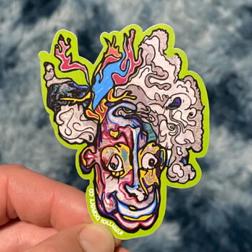 HAZY 2FACE STICKER — 3″ Step into the smoke with Hazy 2Face, a mind-bending character straight from the Internal Bakery imagination. Look at him one way and he’s kickin’ back, blowing out a hazy puff — flip him upside down and suddenly you’re face-to-face with a happy clown from another dimension. Part of the fan-favorite 2Face Series, this hand-drawn design is all about duality, perception, and seeing how imagination can flip the world around you. Perfect for laptops, water bottles, and anywhere you want to remind yourself that there’s always another side to the story. — Hand-drawn by Zach Ray in Colorado Springs, CO — 3″ durable vinyl sticker — Twist it. Flip it. Smoke it out.