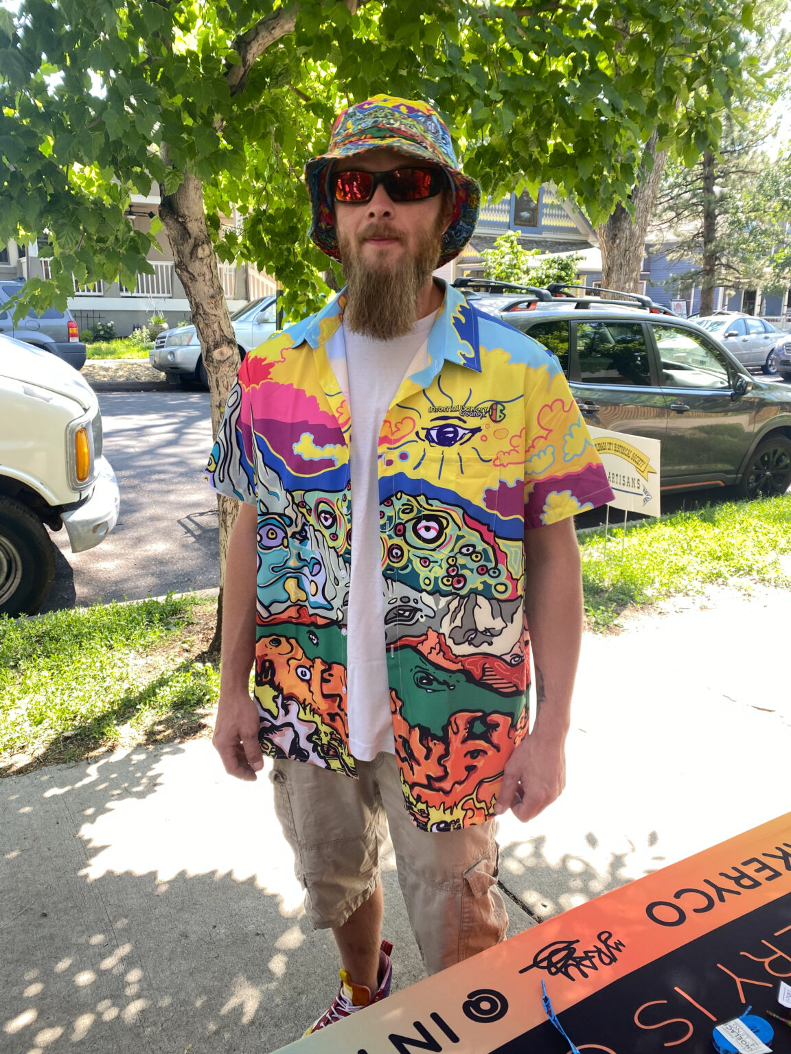 The 'Trippy Mountain' Friend-Making Shirt – See the Wild 🎨🐟👁️ Dive into a world of imagination with the Trippy Mountain Button-Up, featuring Zach Ray’s hand-drawn Front Range Mountains and Garden of the Gods with faces and characters embedding into the scene, this shirt captures the spirit of adventure—perfect for those who love to stand out and spark conversations. More than just a shirt, it’s a statement piece that invites curiosity, connection, and creativity. Whether you're by the water, in the mountains, or out in the wild, the Trippy Mountains is your bold companion for any adventure. ✨ Wear the unexpected. Make new friends. Unlock the Wild Within.