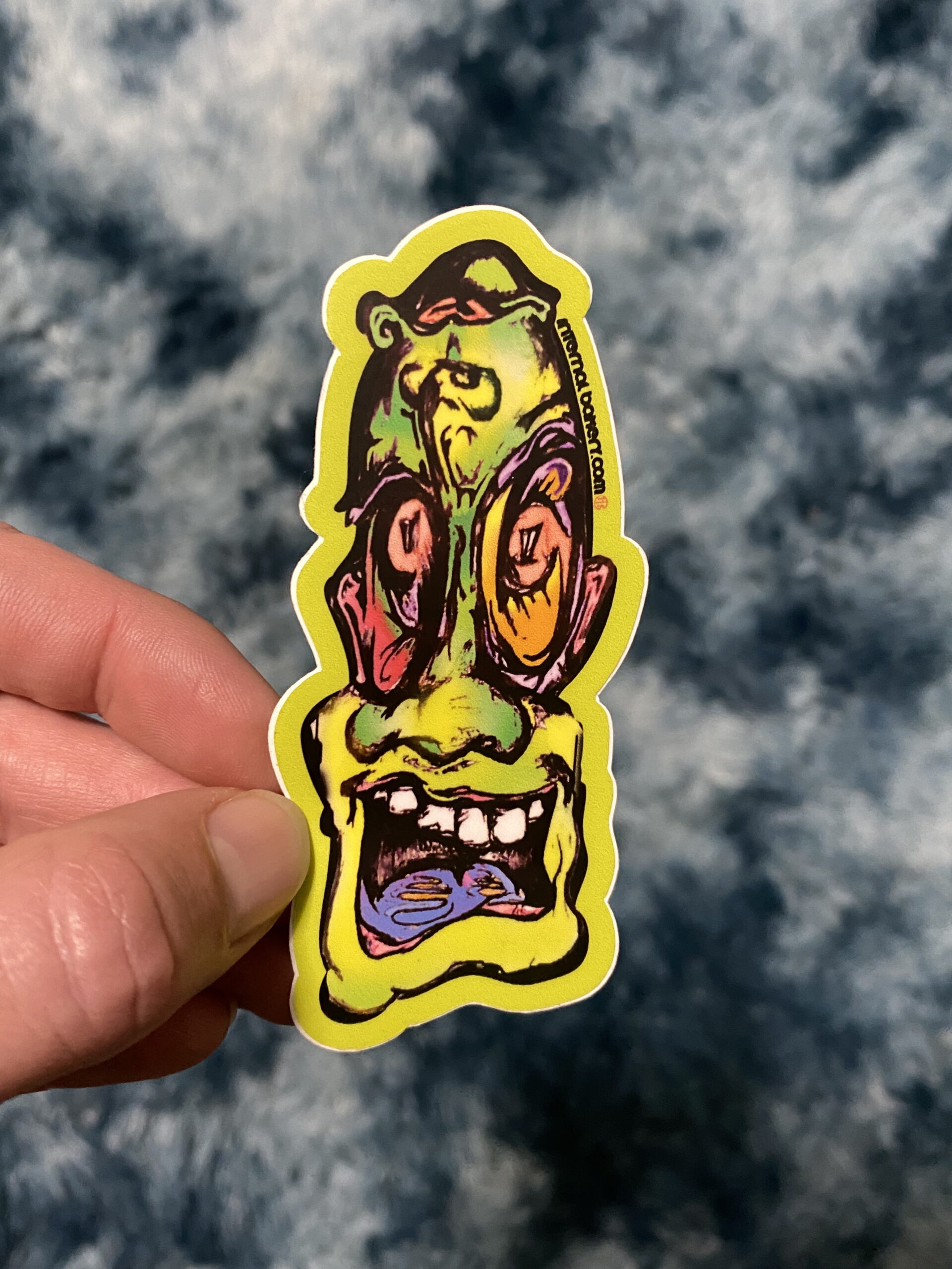 JOHNNY 2FACE STICKER — 3" (The OG) Meet Johnny 2Face — the original mind-twister that started it all. One way, he’s all smiles and good vibes. Flip him upside down and boom — a suave mustache melts right into his face, shifting his energy into something a little mysterious… a little feminine… a little both. Drawn straight from the depths of imagination, Johnny 2Face plays with balance, duality, and the fluid dance between masculine and feminine. He’s the OG from the 2Face Series, a reminder that who we are depends on how you look at it — and sometimes, it’s worth flipping your perspective. — Hand-drawn by Zach Ray in Colorado Springs, CO — 3" durable vinyl sticker — The OG that unlocked the 2Face universe 🌗
